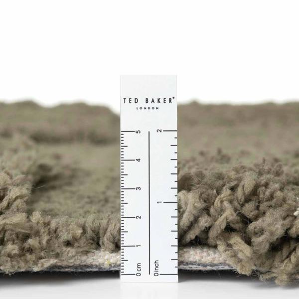 Textured fabric with a ruler and 'Ted Baker London' label
