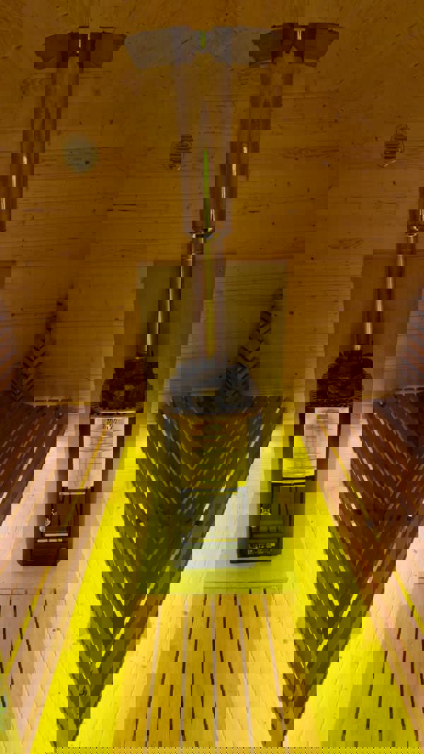 Sauna interior photo from October 6, 2024, showing heater and benches.