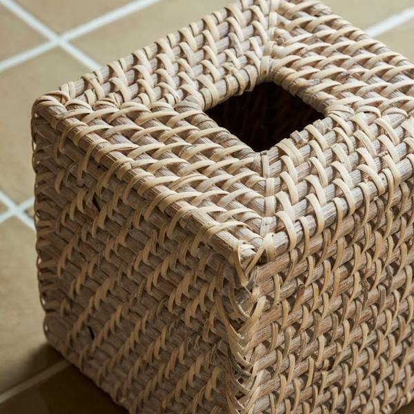 Top-down view of an empty square whitewash rattan tissue box holder.