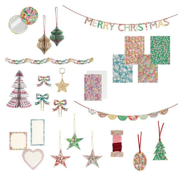 Contents of the Liberty print advent calendar including notebooks, paper decorations, garlands, keychains, and stationery.