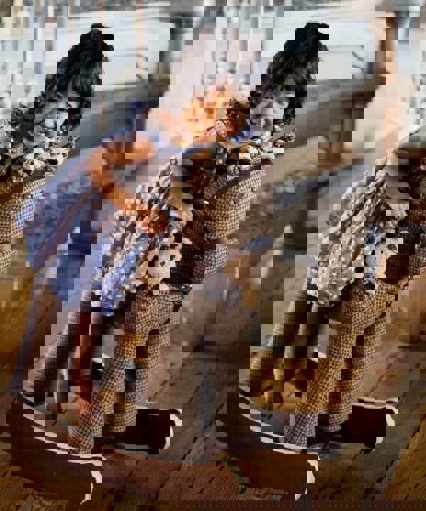 Little girl riding on Chester & Fred Rockin Horse with sturdy wooden frame