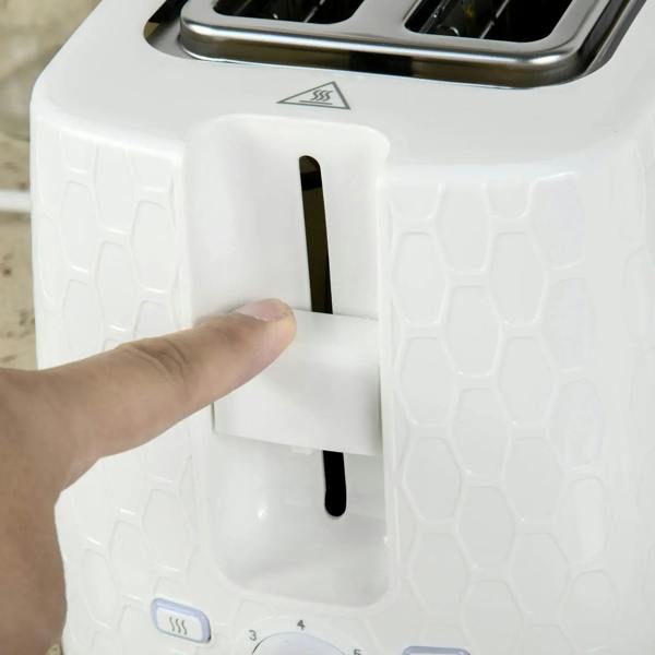 Cream 2-slice toaster with lift lever shown by a hand