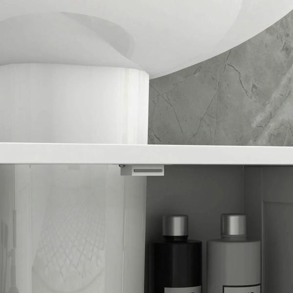 Open interior of a white under-sink cabinet with shelf support and stored bottles