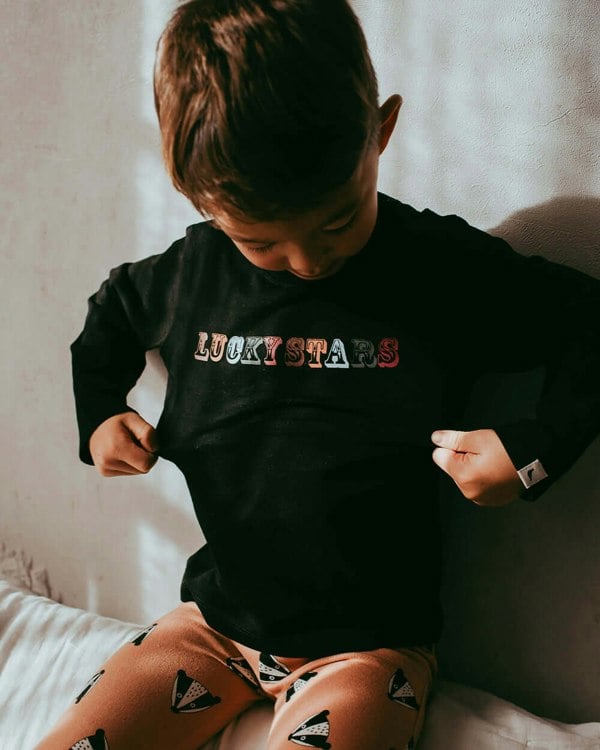 Boy wearing unisex organic cotton kids long-sleeve top