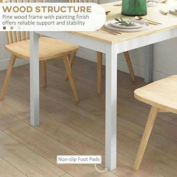 Natural wood tabletop on white legs with non-slip foot pads, side angle