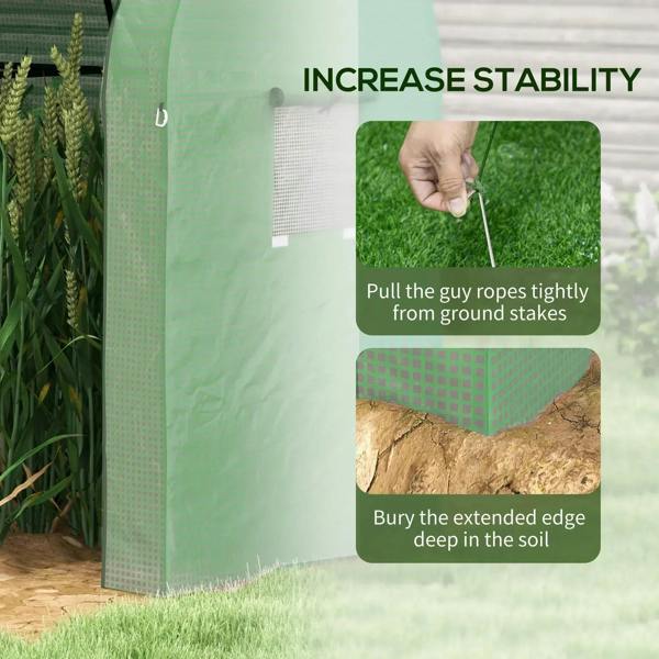 Green mesh greenhouse stabilized with guy ropes and ground stakes