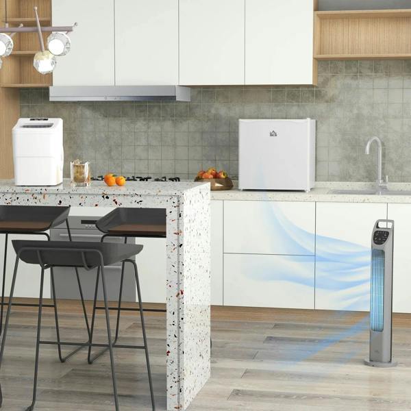 Cream tabletop mini fridge placed on kitchen counter with front door