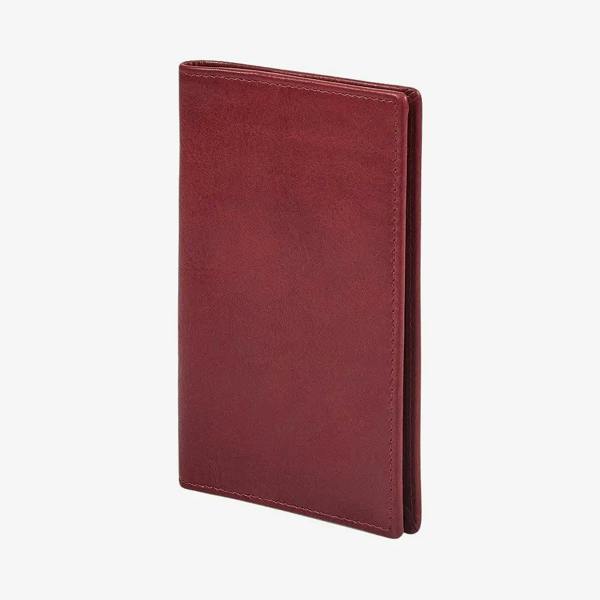 Side view of Bordeaux leather passport holder on a white background