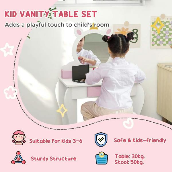 Kids unicorn vanity table set with round unicorn mirror and laptop on a white tabletop.