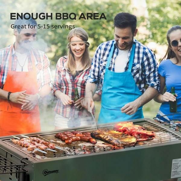 Green portable charcoal BBQ grill with charcoal tray and cooking grates, food grilling
