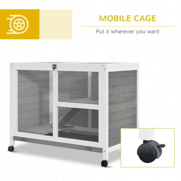 Grey wooden rabbit hutch on caster wheels, front doors open, with two-tier interior