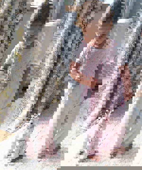 Baby Girl pulling Celeste Unicorn Pull Along Toy