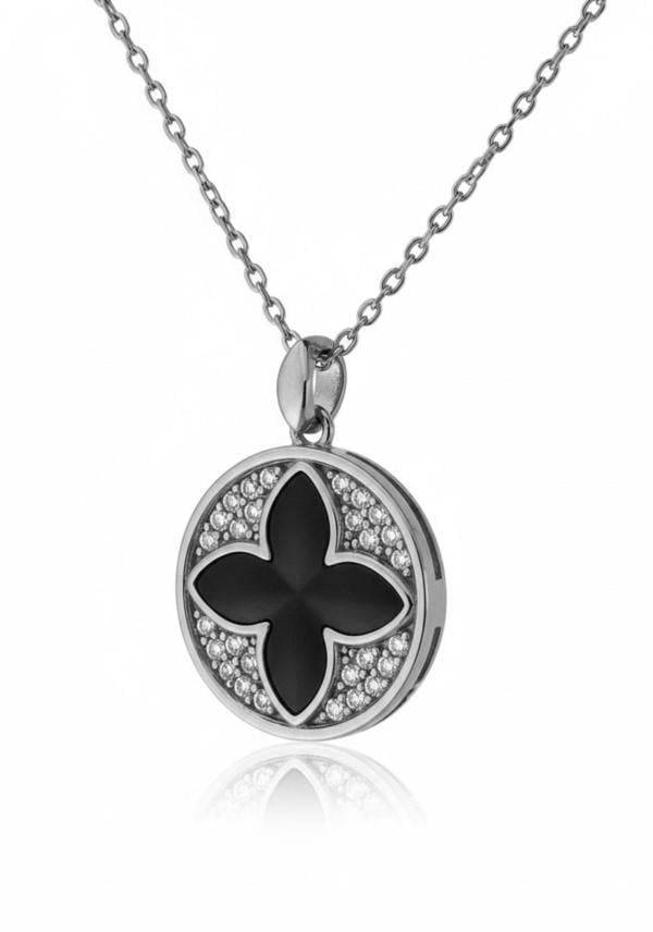 Silver necklace with a black flower pendant on a white background
