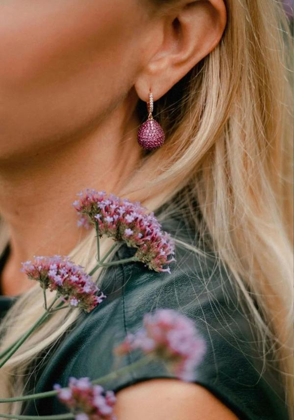 The earring worn by a model.