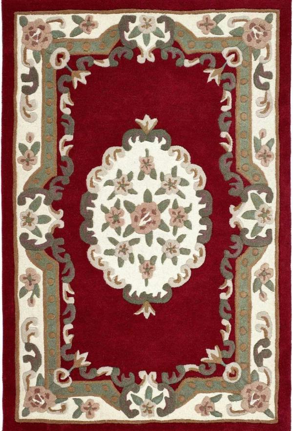 Decorative rug with floral patterns on a red background