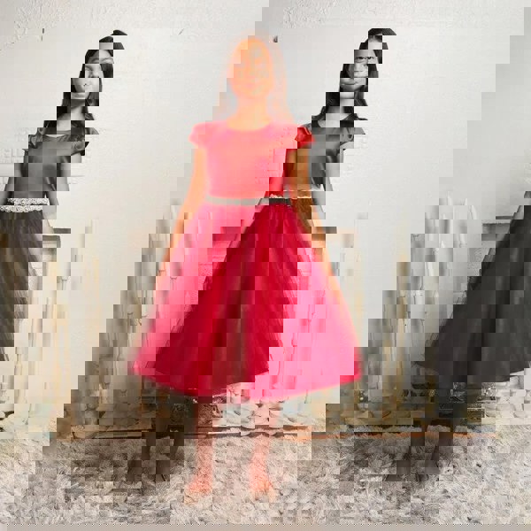 girl wearing a red party Dress from uk flower girl boutique