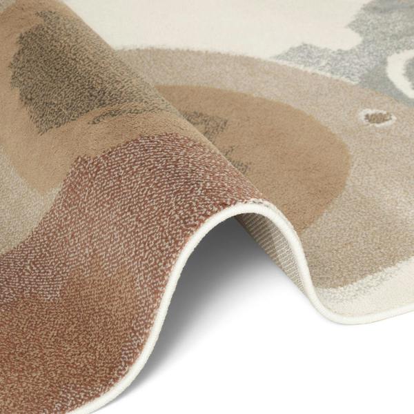 Close-up of a textured rug with geometric pattern on a white background