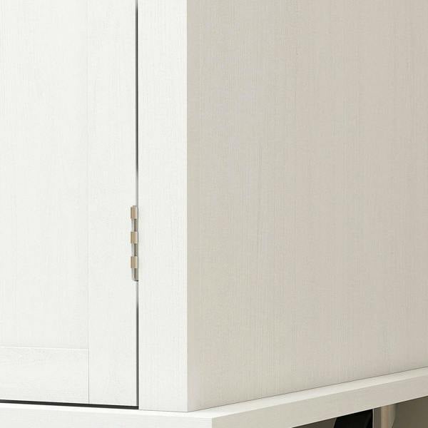 White cabinet door hinge detail on a kitchen storage trolley