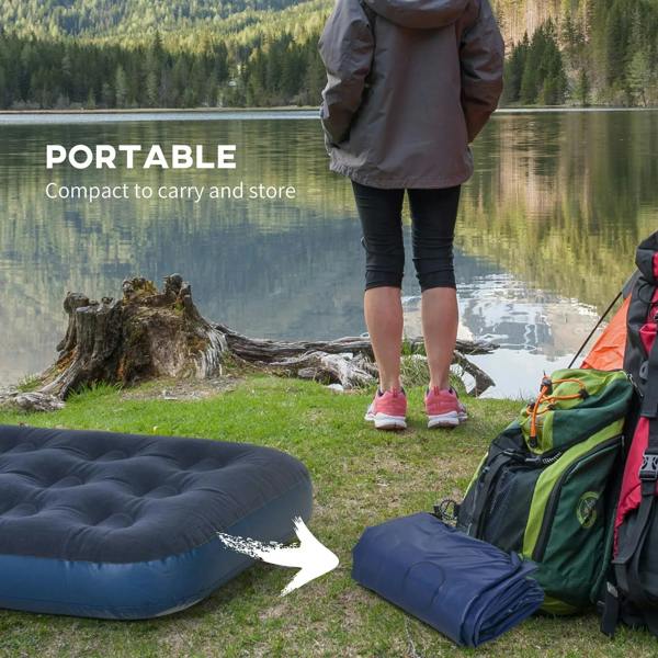 Single inflatable air mattress, blue, set up outdoors by the lake