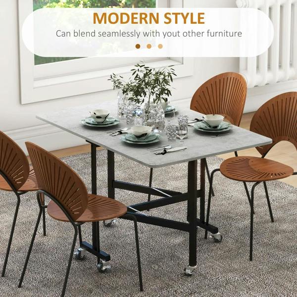 Grey marble-effect drop-leaf dining table with black legs on caster wheels