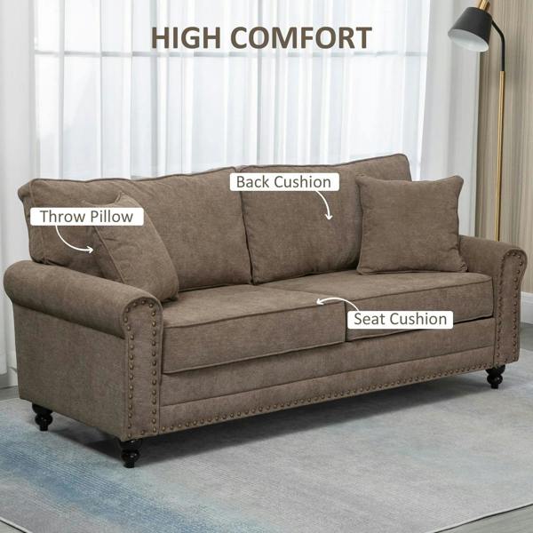 Brown fabric sofa showing back and seat cushions, with two throw pillows and nailhead trim