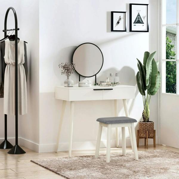 White dressing table with round mirror and gray upholstered stool