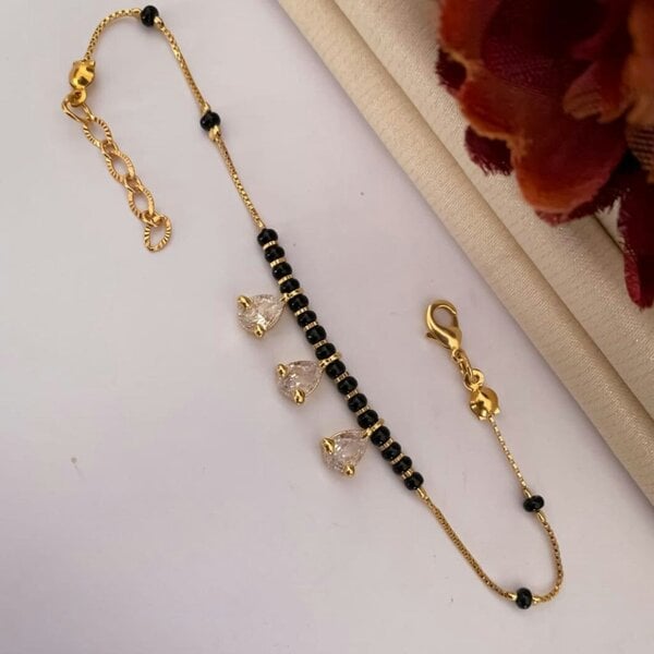 The Colourful Aura Black Bead Mangalsutra Zircon drop gold nazar Bracelet