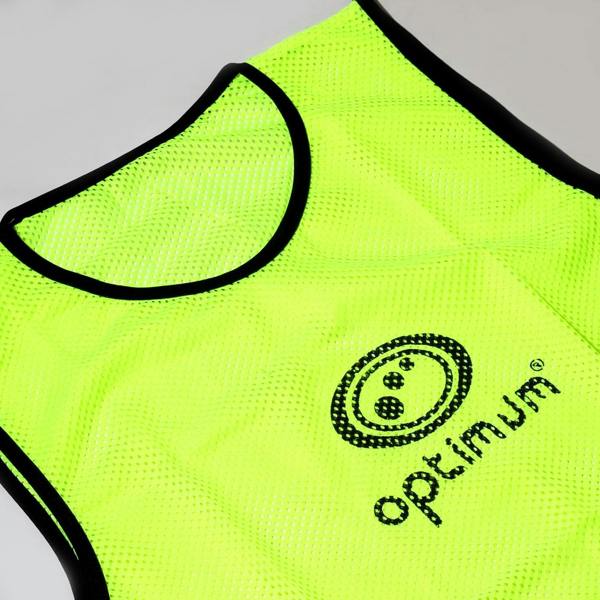 Fluorescent yellow mesh Optimum training bib laid flat with black trim and logo, on grey background - Optimum
