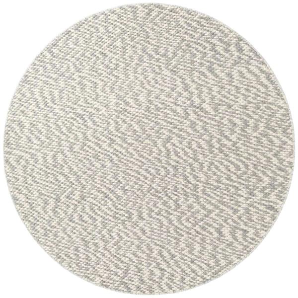 Round gray rug with a textured pattern on a white background