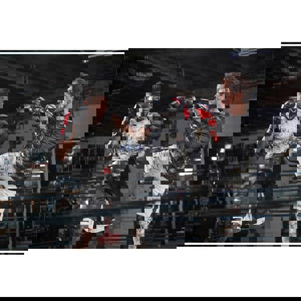 Two men in a boxing ring wearing Reebok Combat Leather Boxing Gloves - Kickboxing Training