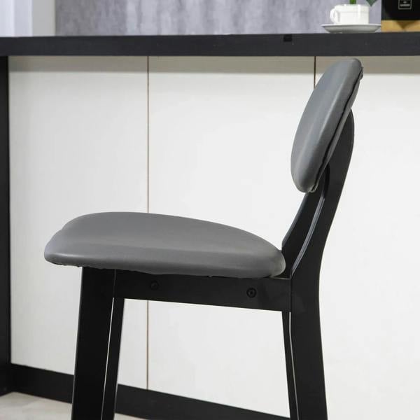 Dark grey bar stool with rounded backrest, padded seat, and solid wood legs