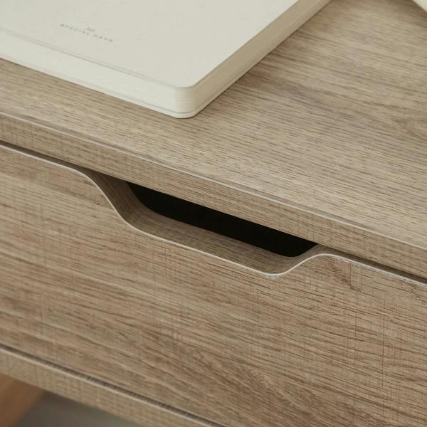 Light natural wood nightstand drawer with curved pull cutout opening