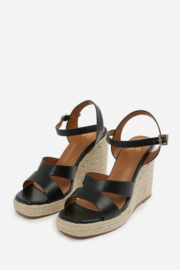 Where's That From Sansa Wide Fit Cut Out Strap Detail Wedge Shoes With Buckle Closure in Black Grain Pu