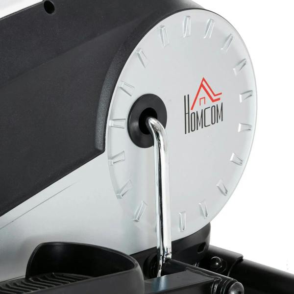 Silver flywheel disc with center axle on elliptical cross trainer