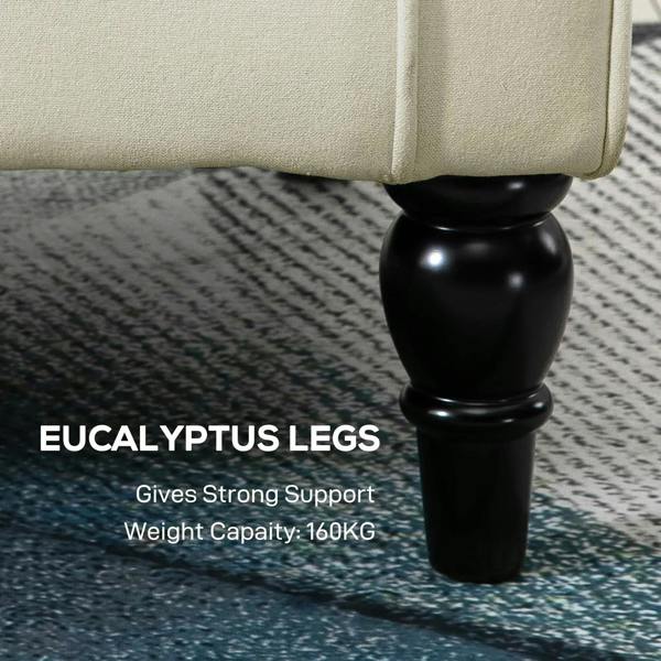 Cream accent chair detail showing rounded turned legs and fabric upholstery