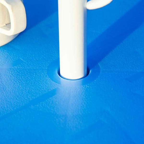 Umbrella support pole base on blue fabric, part of kids bistro set