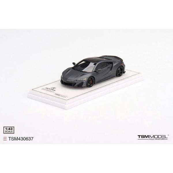 a toy car on a white surface