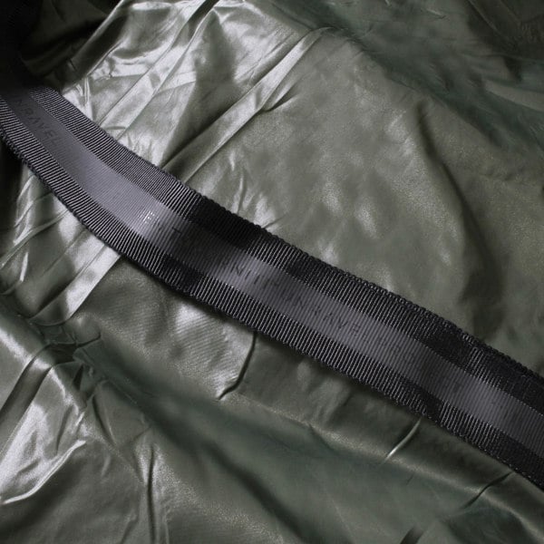 Ben Taverniti Unravel Project jacket<br>A wrapped down jacket in khaki green with contrasting black banding