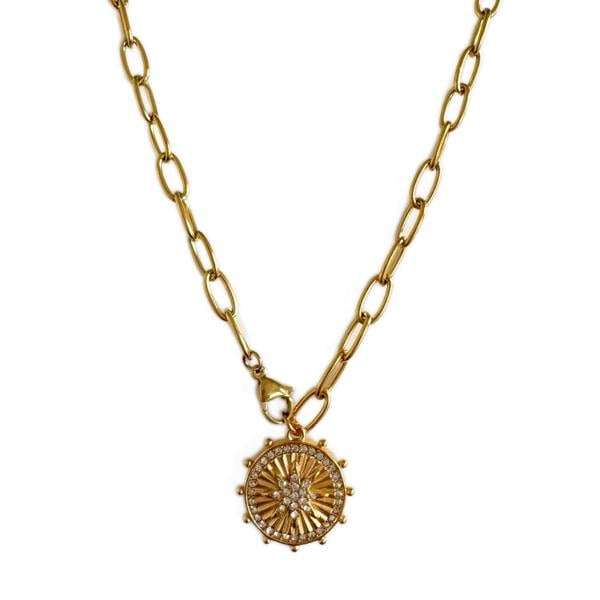 Gold necklace with a circular pendant on a white background
