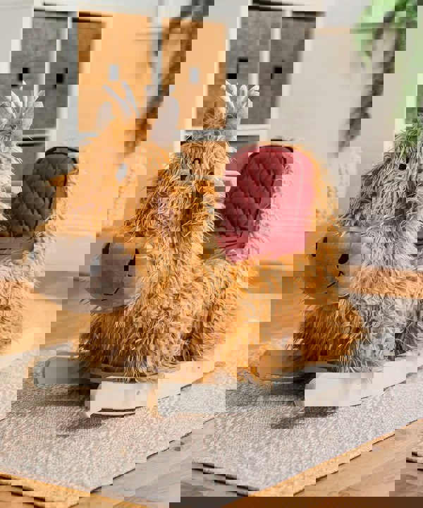 Highland cow rocker on a rug