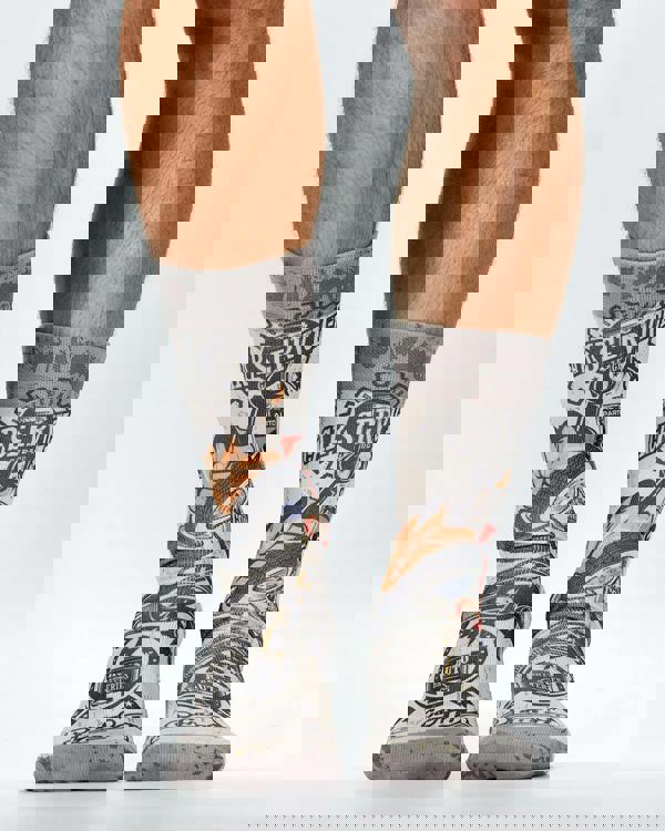 Gray socks with mechanical design worn by a person on a white background