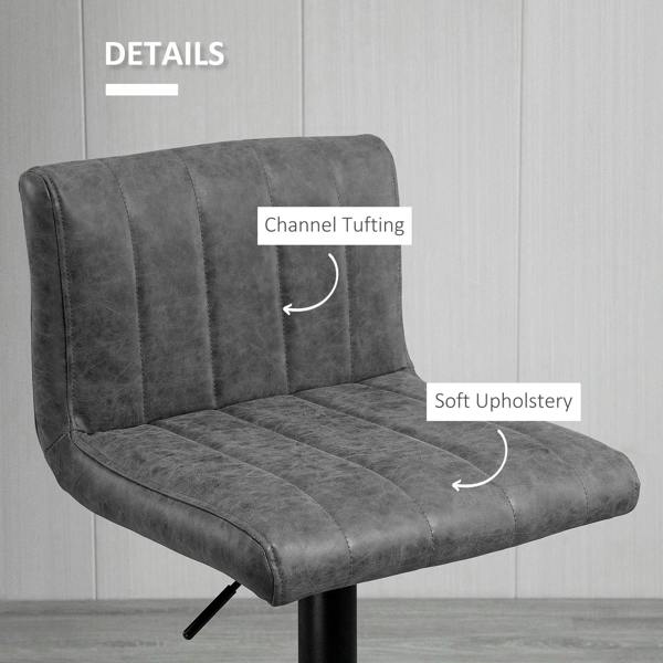 Grey upholstered barstool with channel tufting and cushioned seat on black support