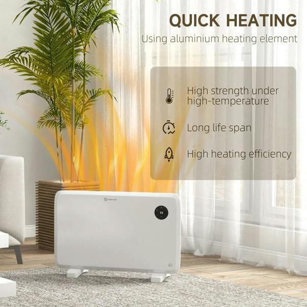 White electric convector heater with black thermostat dial on two feet, near a remote control.