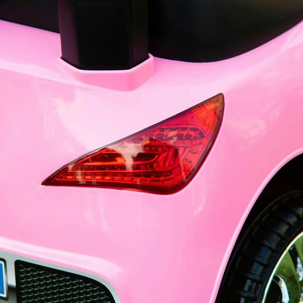 Close-up of pink ride-on car rear tail light and body panel
