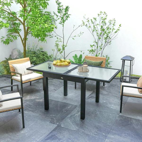 Black extendable outdoor dining table with clear tempered glass top and sturdy aluminum legs