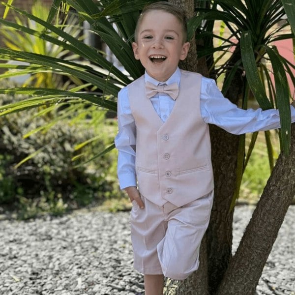 young boy smiling wearing the Jake suit