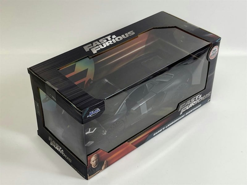 a black toy car in a box