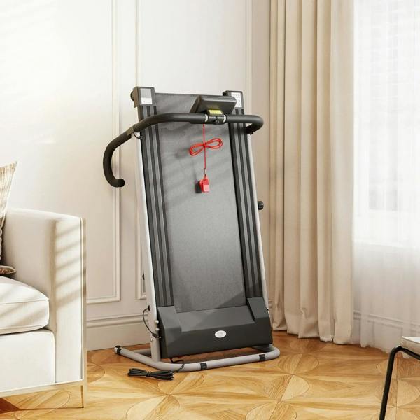 Folding treadmill standing upright, grey running deck, side handrails and LCD console
