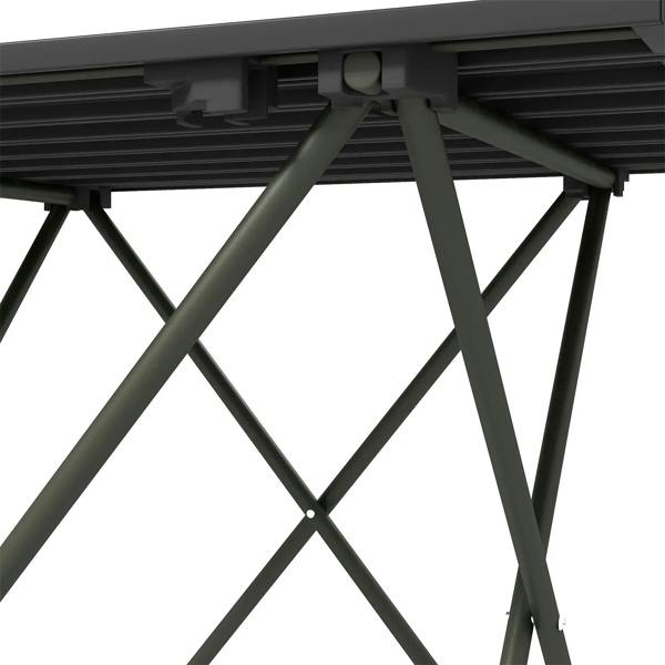 Underside view of folding camping table: black slats and X-brace frame