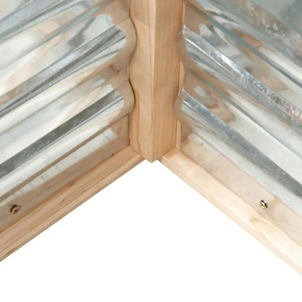 Wooden cold frame greenhouse corner joint with clear panel backing and metal fasteners